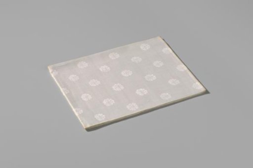 Napkin with a pattern of rosettes and rose branches