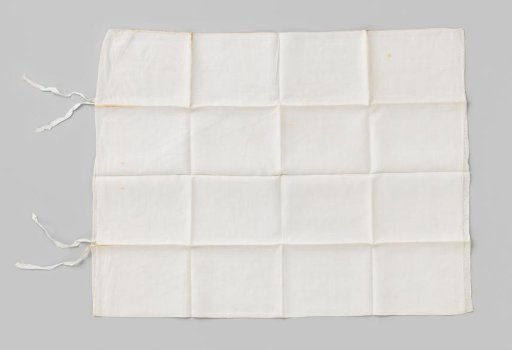 White linen pillowcase with a strip of lace, marked with a crown and B 12