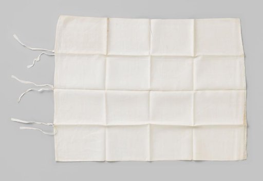 White linen pillowcase with a strip of lace, marked with a crown and B 12