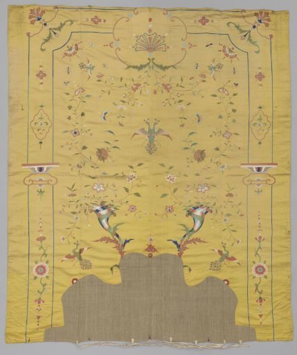 Yellow silk back panel of a bed set