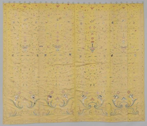 Curtain, yellow, embroidered with vases, floral scrolls, cornucopias, peacocks and butterflies.