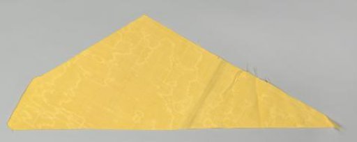 Fragment of a bed set of yellow watered wool with green passementerie and hanging tassels