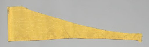 Fragment of a bed set of yellow watered wool with green passementerie and hanging tassels