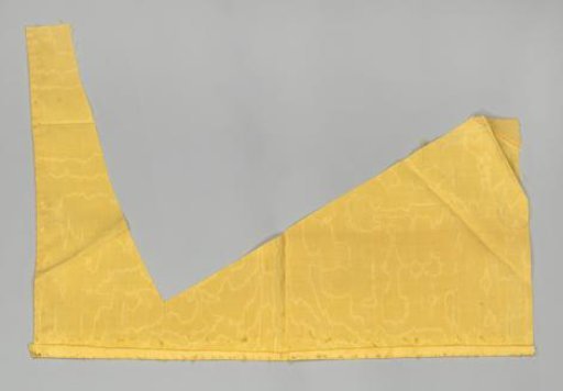 Fragment of a bed set of yellow watered wool with green passementerie and hanging tassels