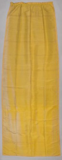 Curtain, yellow, trimmed with passementerie featuring palmettes and curved ribbons.