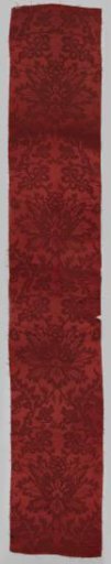 Fragment of red silk fabric; damask.