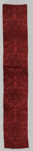Fragment of red silk weave; damask.