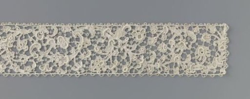 Strip of needle lace with a compound scrolling pattern