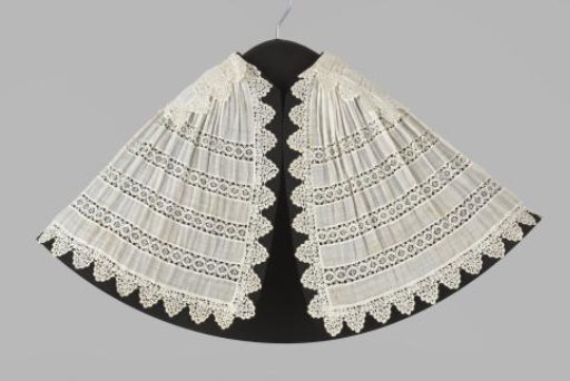 Cape or shoulder cloth of batiste with scalloped edge and insertions of bobbin lace with linked circles