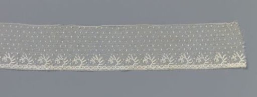 Strip of bobbin lace with one-sidedly directed twigs with stiff straight leaves