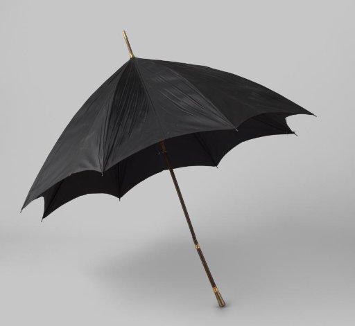 Umbrella with a cover of black silk, on a bamboo shaft, with a conical gilded silver knob and gold band