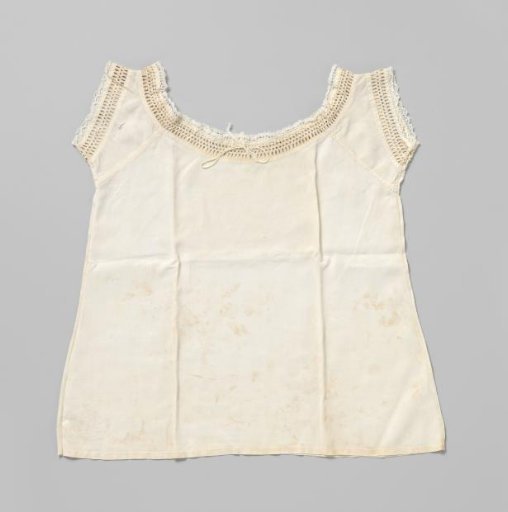 Children's shirt of linen, finished along the neck and shoulders with a wide openwork border and narrow lace