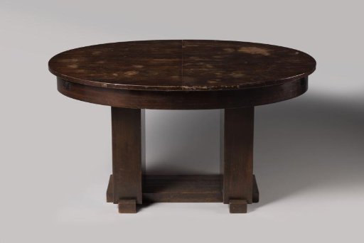 Table with oval tabletop and two side leaves resting on broad rectangular sides