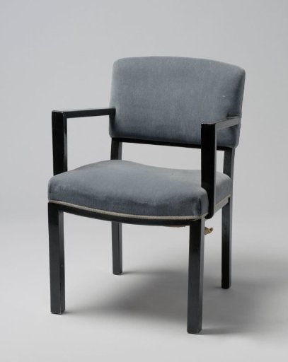 Armchair with angular armrests and upholstered in blue tripp