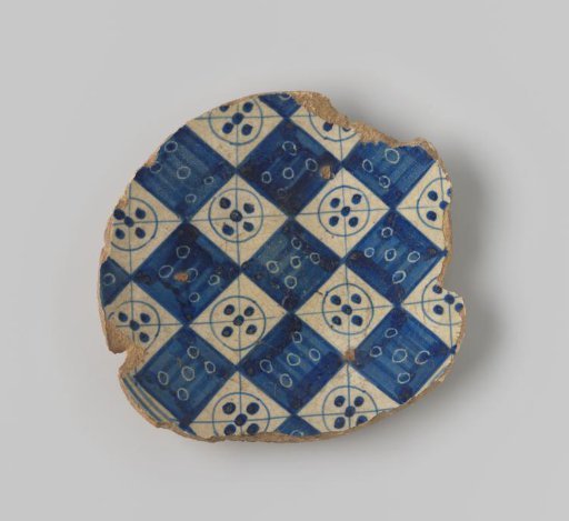 Fragment in the shape of the base of a dish, decorated with a checkerboard pattern