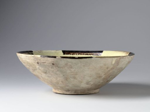 Bowl with four black borders in a white slip