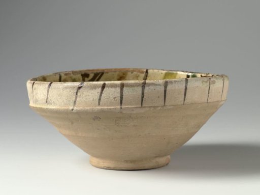 Bowl with panels and lines in brown and green