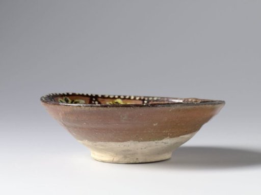 Bowl with stylized flowering plants in panels