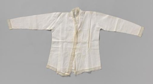 Kabaya of white linen batiste edged all around with a scalloped strip of machine-made lace