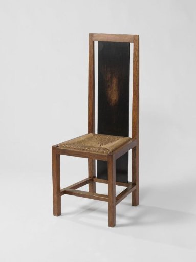 Chair with rush seat and elongated panel at the back