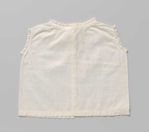 White linen children's shirt without sleeves, trimmed with a narrow border of English embroidery