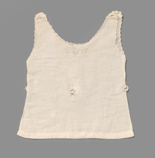 White linen baby shirt with festooned wavy neck and armholes, trimmed with a strip of machine-made lace