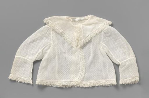 Coarse batiste baby jacket with woven piques and trimmed with a narrow border of embroidery