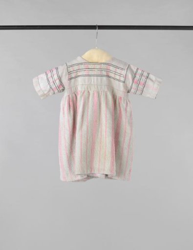 Children's dress with short sleeve, made of a white-pink striped bath towel, trimmed on the bodice with black decorative seams
