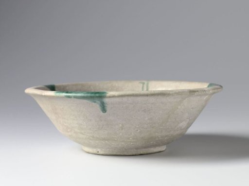 Bowl with (pseudo-)inscription and green spots