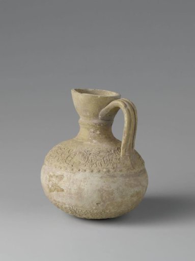 Vessel or pitcher with floral scrolls in relief