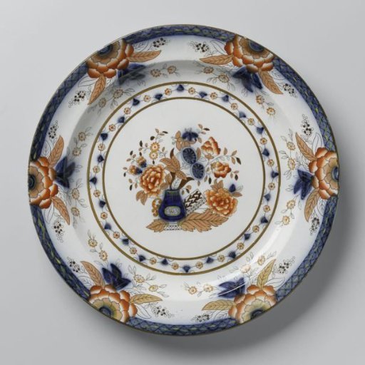 Platter with a vase of flowers in the center