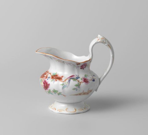 Milk jug, with polychrome decoration featuring a garden vase, a fence, and flowers