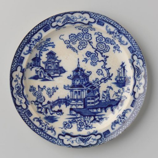 Platter with two buildings and a ship on the surface