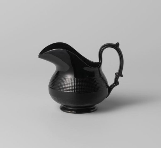 Milk jug, black, decorated with ribbed edges