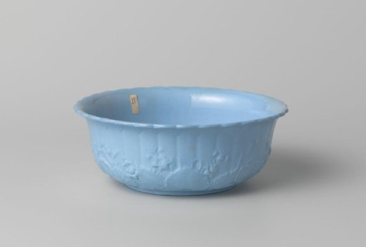 Bowl, blue, with flowers and leaves in relief