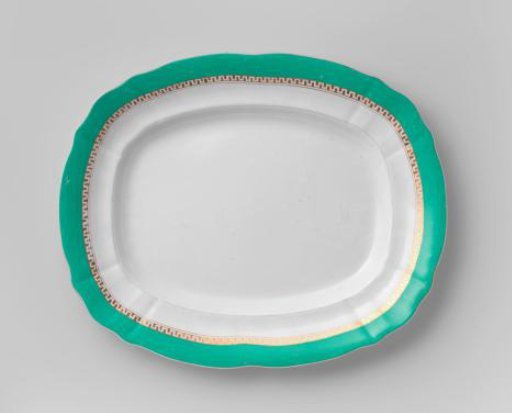 Bowl, oblong, with a green rim and a golden Greek band