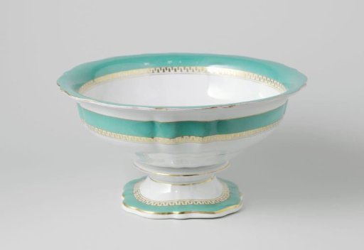 Bowl on a foot with a green rim and a golden Greek band