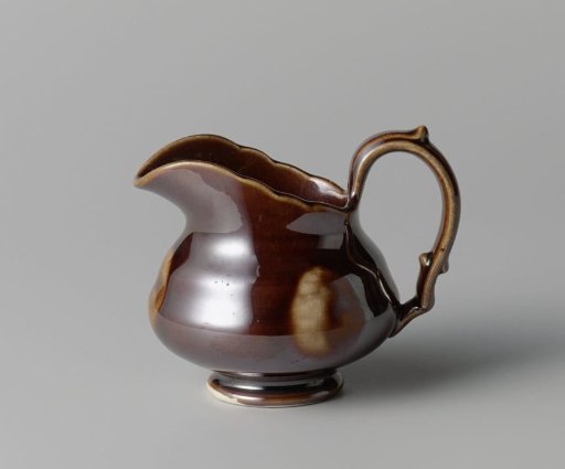 Milk jug, brown with light spots