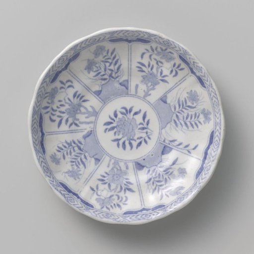 Dish with a scalloped rim and compartments with flowers