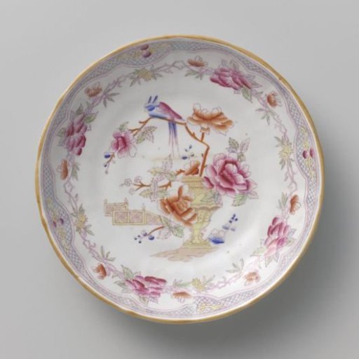 Plate with on the flat a garden vase, flowering branches, a bird and a garden fence