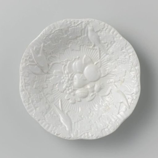 Fruit bowl with grapevines, fruit and birds in relief