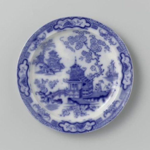 Plate with pagoda branches blooming loosely over the flat surface and a ship