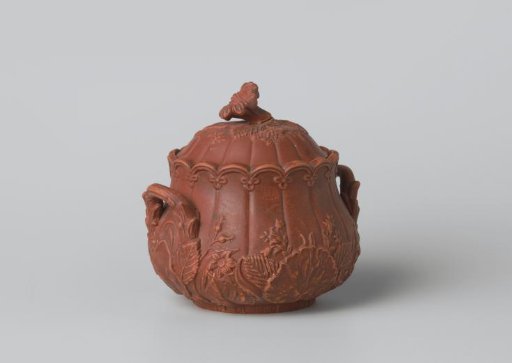 Lid, lobed, with flowers and leaves in relief