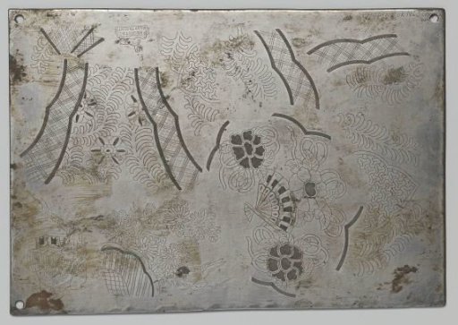 Plate with engraved decorations for a lidded earthenware pot