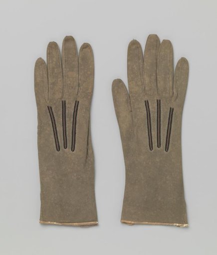 Left-hand glove of green spotted suede