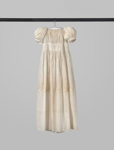 Children's dress/baptismal gown of white linen above the hem, decorated with a border of broderie anglaise