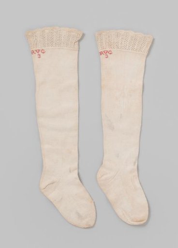 Stocking of plain knitted white cotton with openwork edge, children's size
