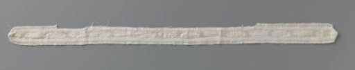 Insert of bobbin lace with volute motif on remnants of linen bed linen with drawn thread work