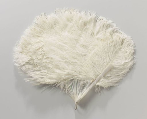 Folding fan of white ostrich feathers on a closed, unworked mother-of-pearl mount