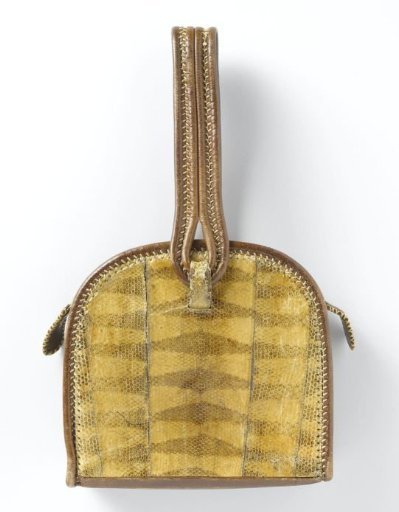 Handbag in a semi-circular shape, of brown harness leather, garnished with snakeskin